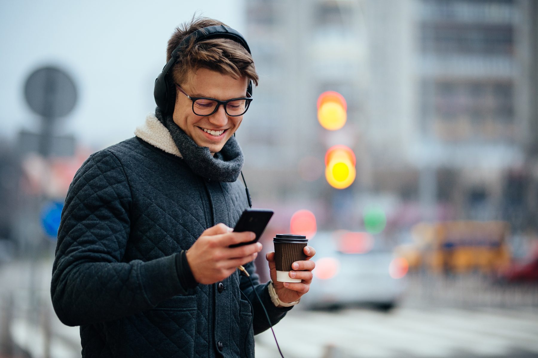 Man checking phone for cab