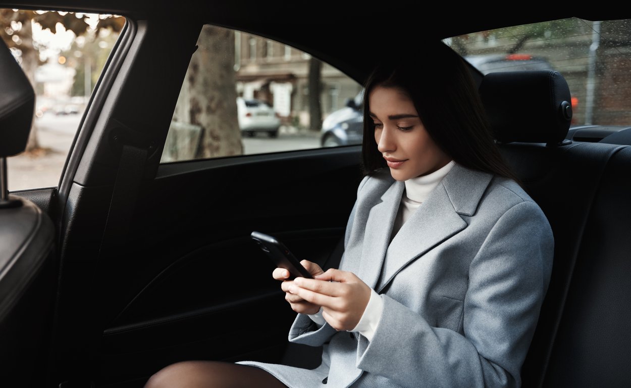 Passenger booking a cab on a phone